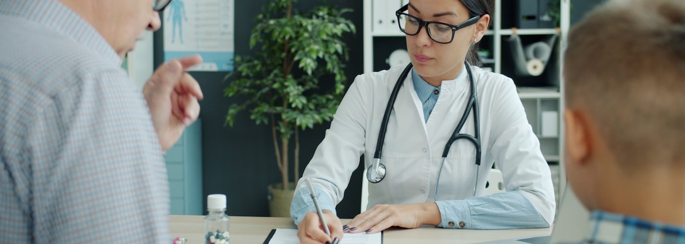 Doctor consulting with patient about health insurance options